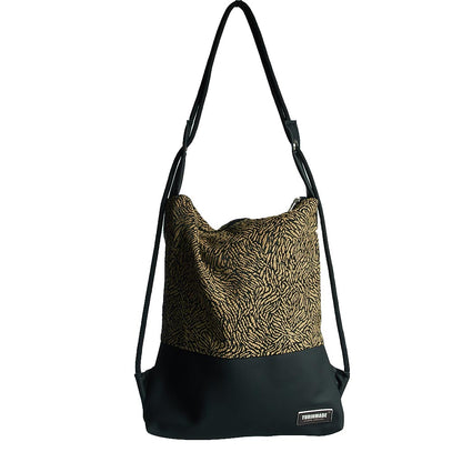Como 24 – Zaino-borsa artigianale in jacquard nero e oro